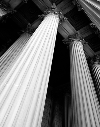 Columns on courthouse building representing strength and support